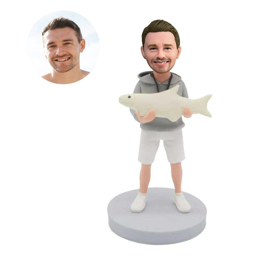 custom male bobbleheads holding a fish