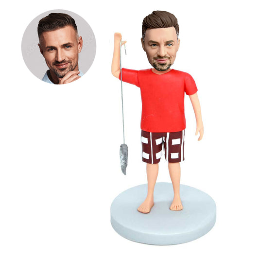 custom male fisherman bobbleheads carrying a fish