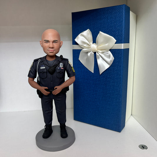 custom policeman bobbleheads holding a pistol